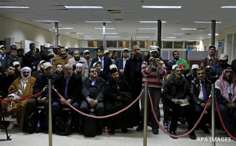 A convoy of "Miles of Smiles 8" carrying medical aid to Gaza crosses the Rafah crossing into the southern Gaza Strip from Egypt on Jan 14, 2012. The convoy, carrying medical aid for the impoverished Palestinian territory...