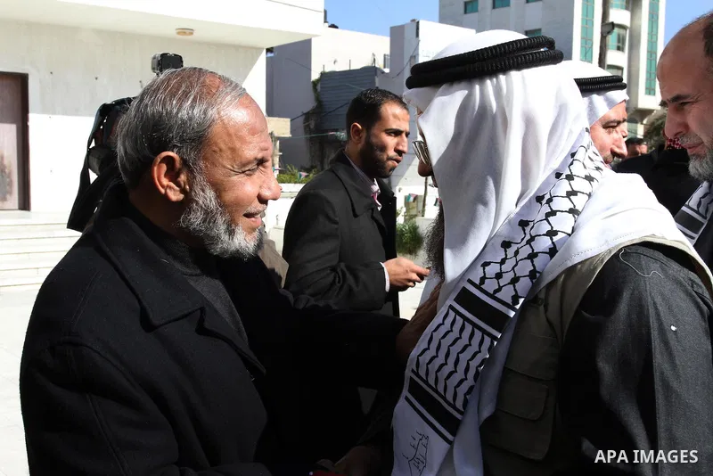 Palestinian Hamas leader, Mahmoud al-Zahar, recieves members of the "Miles of Smiles 8" aid convoy at the parliament headquarters in Gaza city on Jun 15, 2012. Photo by Mohammed Asad