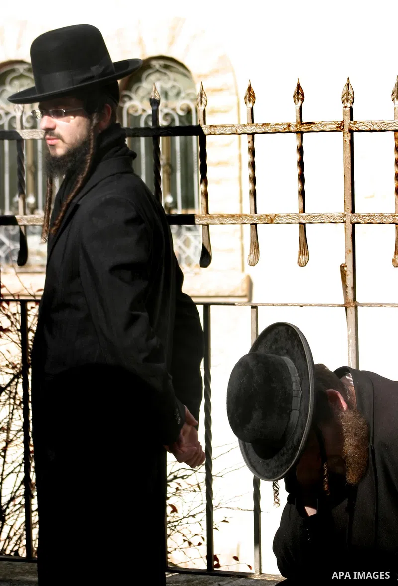 Ultra Orthodox Jewish men attend a demonstration against the arrest of six Ultra Orthodox Jews suspected of tax evasion in the Meah Shearim Neighborhood, Jerusalem, 15 January 2012. Reports state that three men were arre...