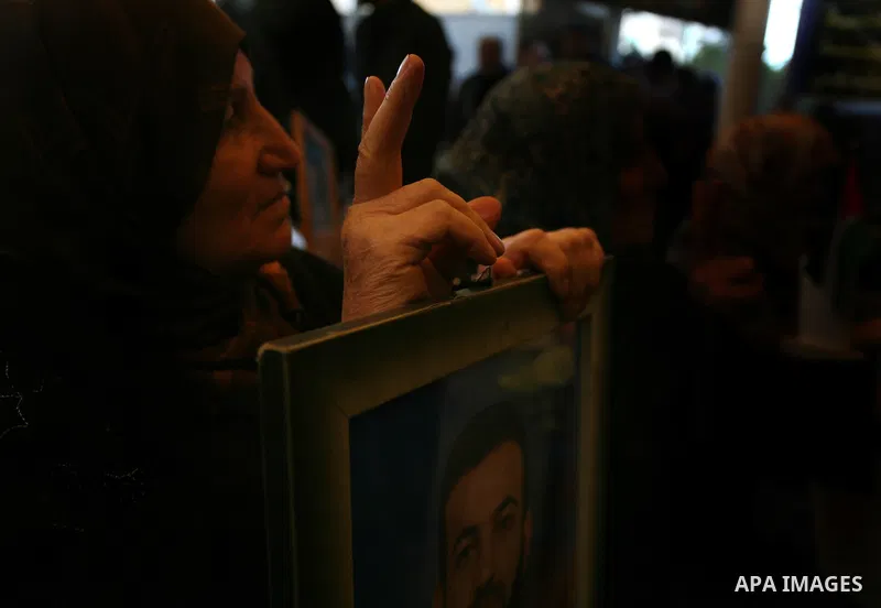 Palestinians woman hold pictures of their prisoned relatives in Israeli jails as they gather in a weekly activity calling for their liberty at the Red Cross headquarters in Gaza City on Jan. 16, 2012. Photo by Mahmoud Na...