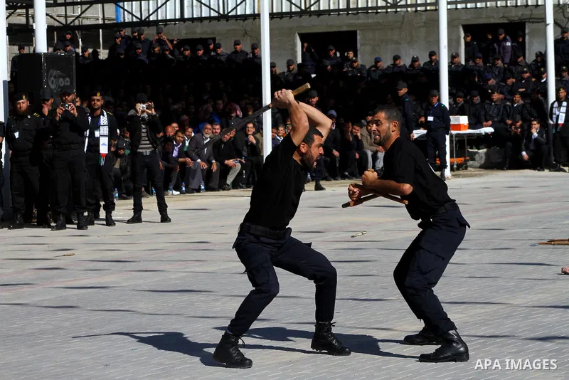 Palestinian members of Hamas security forces during perform mock exercises during a graduation ceremony in Gaza City in Gaza City on Jan. 16, 2012. Photo by Ashraf Amra