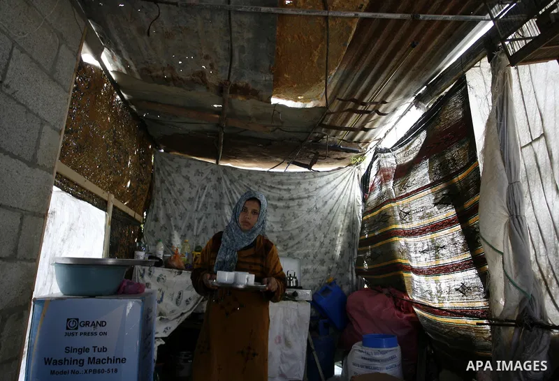 Palestinian family of five persons lives below the poverty line in a refugee camp of Khan Younis in southern Gaza Strip on January 16, 2012. By the third anniversary of the war on Gaza, the agency of the United Nations R...