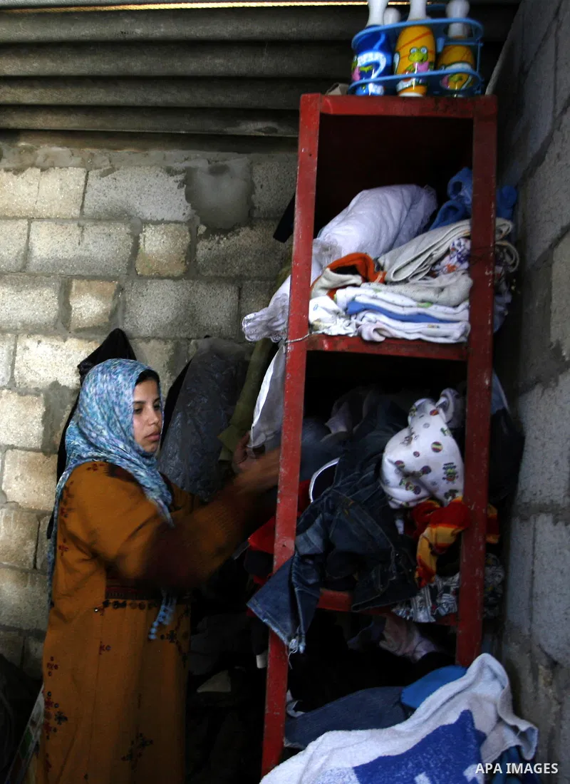 Palestinian family of five persons lives below the poverty line in a refugee camp of Khan Younis in southern Gaza Strip on January 16, 2012. By the third anniversary of the war on Gaza, the agency of the United Nations R...