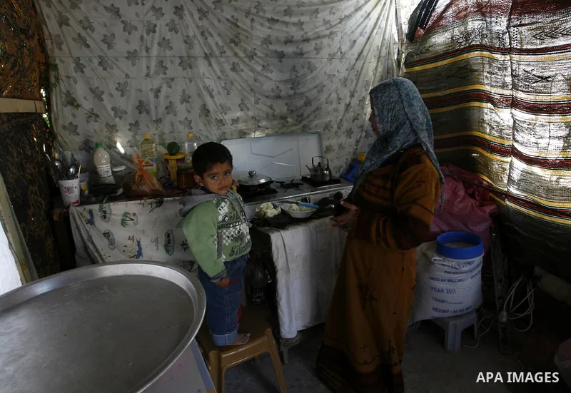 Palestinian family of five persons lives below the poverty line in a refugee camp of Khan Younis in southern Gaza Strip on January 16, 2012. By the third anniversary of the war on Gaza, the agency of the United Nations R...