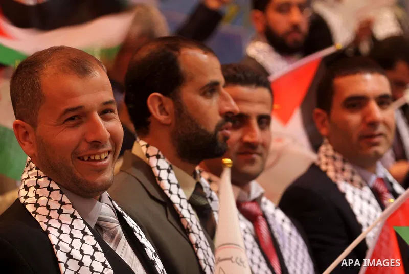 Palestinian bridegrooms attend a mass wedding organized by Waed Association for around 50 released Palestinian prisoners in Gaza city on January 17, 2012. Israel freed 550 Palestinian prisoners on December 19, 2011, comp...