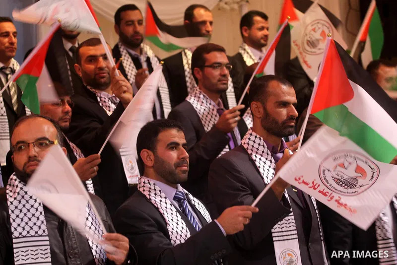 Palestinian bridegrooms attend a mass wedding organized by Waed Association for around 50 released Palestinian prisoners in Gaza city on January 17, 2012. Israel freed 550 Palestinian prisoners on December 19, 2011, comp...