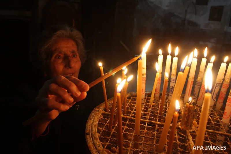 Christians light candles during celebration during an Armenian Christmas procession in the Church of the Nativity in West Bank city of Bethlehem, Wednesday, Jan. 18, 2012. The Armenian Orthodox church in the Holy Land ce...