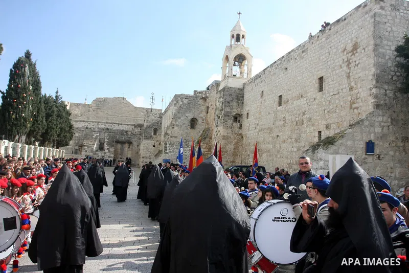 Christians celebrate during an Armenian Christmas procession through Manger Square to the Church of the Nativity in West Bank city of Bethlehem, Wednesday, Jan. 18, 2012. The Armenian Orthodox church in the Holy Land cel...