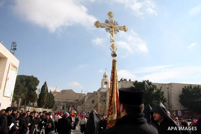 Christians celebrate during an Armenian Christmas procession through Manger Square to the Church of the Nativity in West Bank city of Bethlehem, Wednesday, Jan. 18, 2012. The Armenian Orthodox church in the Holy Land cel...