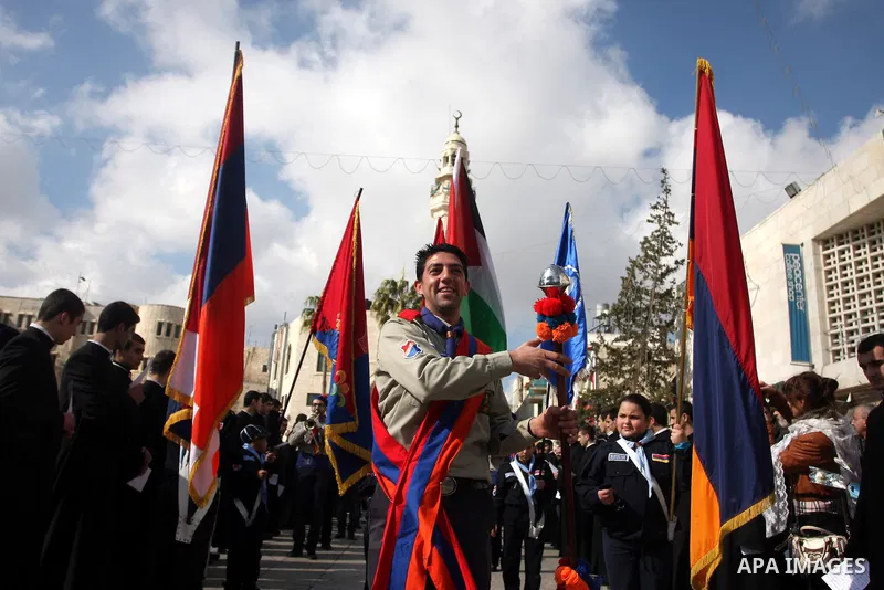 Christians celebrate during an Armenian Christmas procession through Manger Square to the Church of the Nativity in West Bank city of Bethlehem, Wednesday, Jan. 18, 2012. The Armenian Orthodox church in the Holy Land cel...