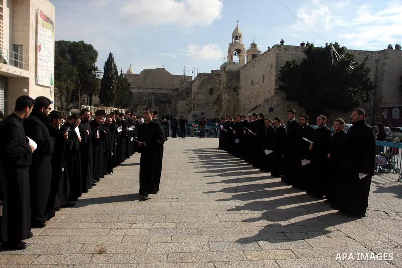 Christians celebrate during an Armenian Christmas procession through Manger Square to the Church of the Nativity in West Bank city of Bethlehem, Wednesday, Jan. 18, 2012. The Armenian Orthodox church in the Holy Land cel...