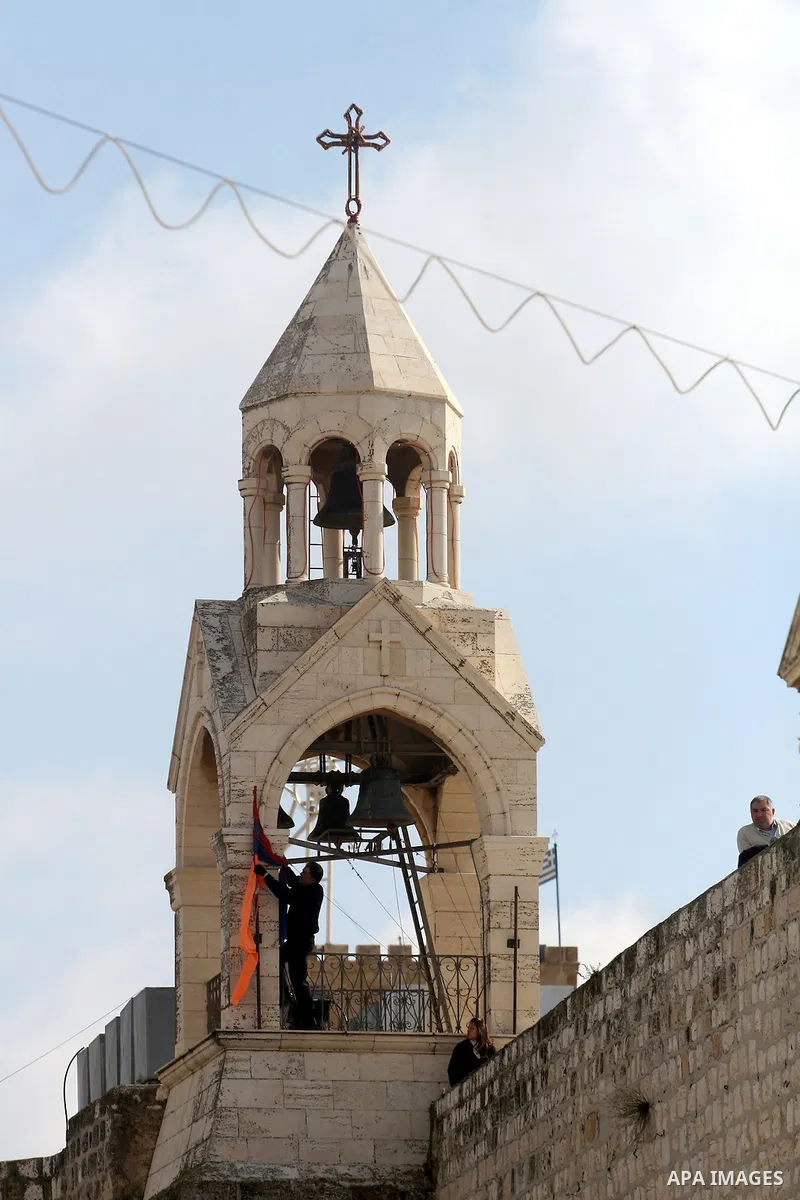 Christians celebrate during an Armenian Christmas procession through Manger Square to the Church of the Nativity in West Bank city of Bethlehem, Wednesday, Jan. 18, 2012. The Armenian Orthodox church in the Holy Land cel...