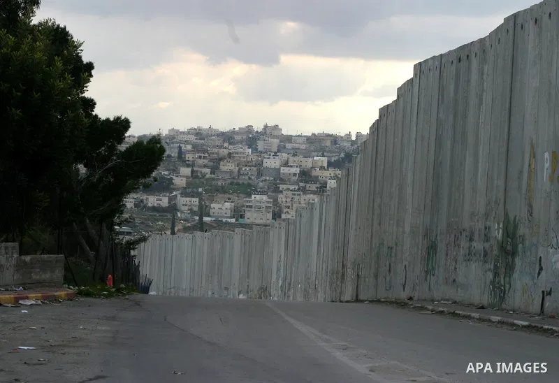 A view shows a section of Israel's controversial concrete barrier that separates the West Bank from Jerusalem on Jan.18, 2012. in Abu Dis, in Israeli-annexed east Jerusalem. Photo by Mahfouz Abu Turk