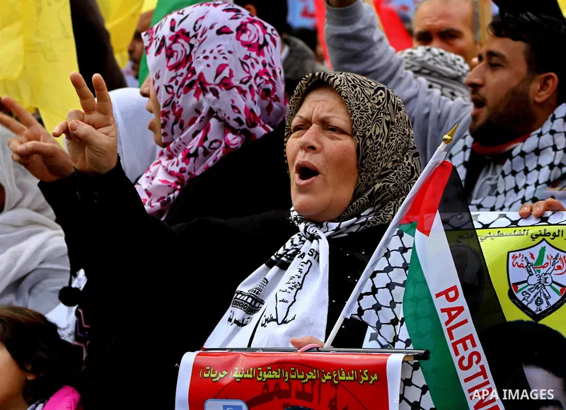 Palestinian women and children hold pictures of their prisoned relatives in Israeli jails as they gather in a protest calling for their liberty at the Red Cross headquarters in Gaza City on Jan. 19, 2012. Photo by Ashraf...