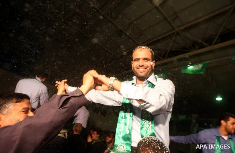 Palestinian bridegrooms attend a mass wedding organized by Hamas Movement for about 10 released Palestinian prisoners, who exiled to Gaza Strip, in Gaza city on January 19, 2012. Israel freed 550 Palestinian prisoners on...