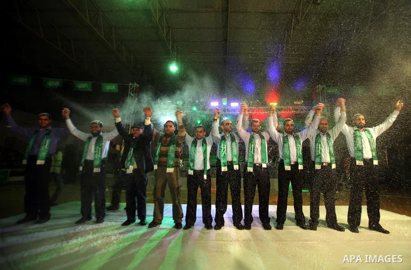 Palestinian bridegrooms attend a mass wedding organized by Hamas Movement for about 10 released Palestinian prisoners, who exiled to Gaza Strip, in Gaza city on January 19, 2012. Israel freed 550 Palestinian prisoners on...