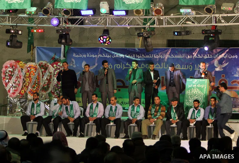 Palestinian bridegrooms attend a mass wedding organized by Hamas Movement for about 10 released Palestinian prisoners, who exiled to Gaza Strip, in Gaza city on January 19, 2012. Israel freed 550 Palestinian prisoners on...