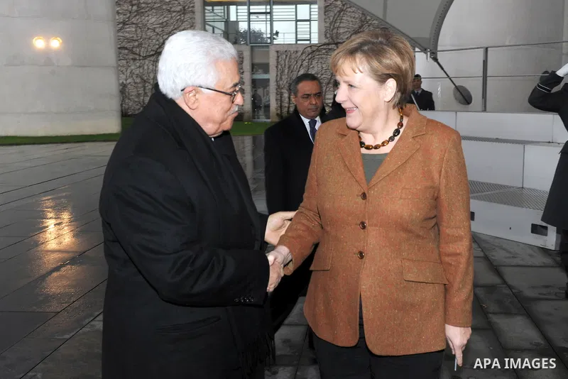 Palestinian president Mahmud Abbas meets with the German chancellor Angela Merkel at the Chancellery in Berlin on January 19, 2012. Photo by Thaer Ganaim