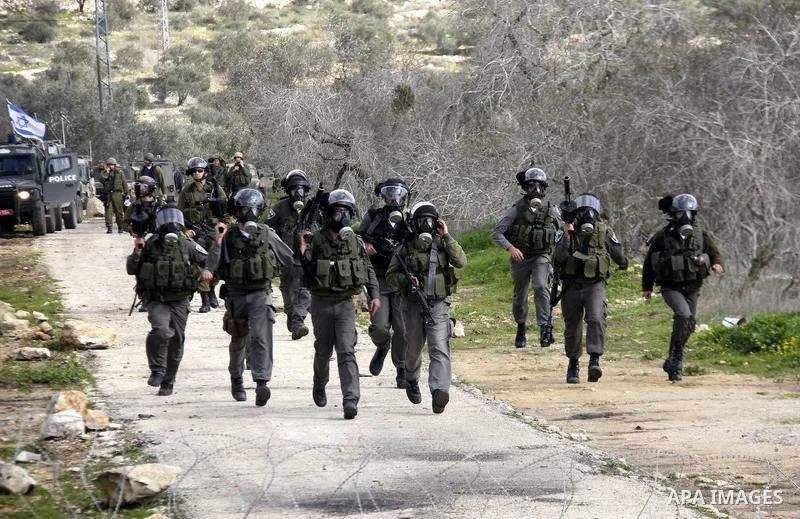 Israeli border officers clash with Palestinian demonstrators during a protest in the village of Kufr Qaddum, near the Israeli settlement of Kdumim, in the northern West Bank, Friday, Jan. 20, 2012. Photo by Wagdi Eshtaya...