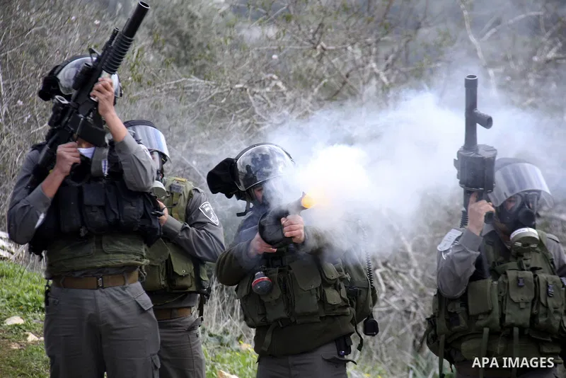 Israeli border officers clash with Palestinian demonstrators during a protest in the village of Kufr Qaddum, near the Israeli settlement of Kdumim, in the northern West Bank, Friday, Jan. 20, 2012. Photo by Wagdi Eshtaya...