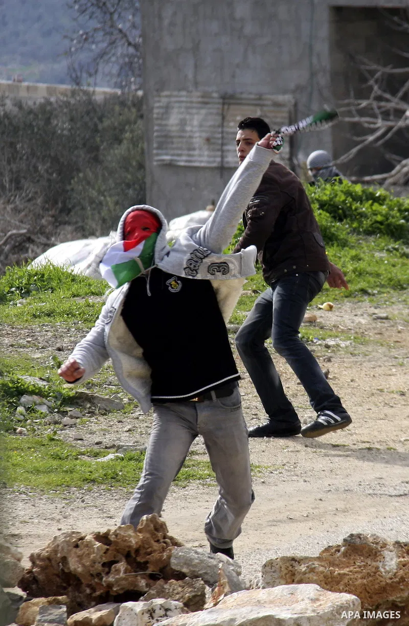 Israeli border officers clash with Palestinian demonstrators during a protest in the village of Kufr Qaddum, near the Israeli settlement of Kdumim, in the northern West Bank, Friday, Jan. 20, 2012. Photo by Wagdi Eshtaya...