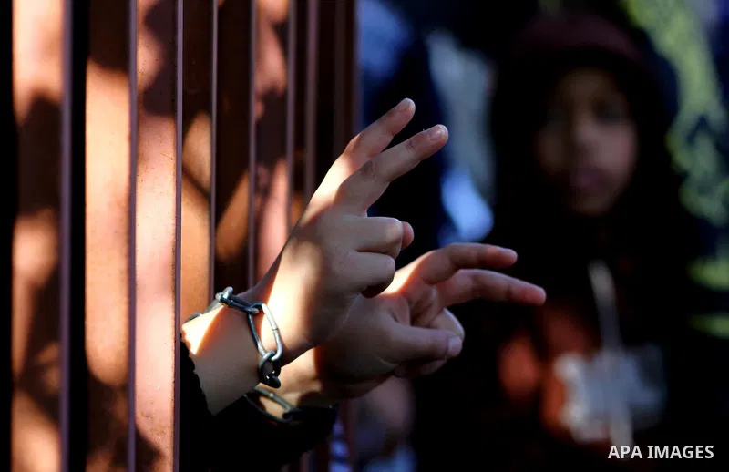 Families of Palestinian prisoners held in Israeli jails take part in a demonstration demanding their release, outside the Red Cross office in Gaza City, Jan. 21, 2012. Photo by Ashraf Amra