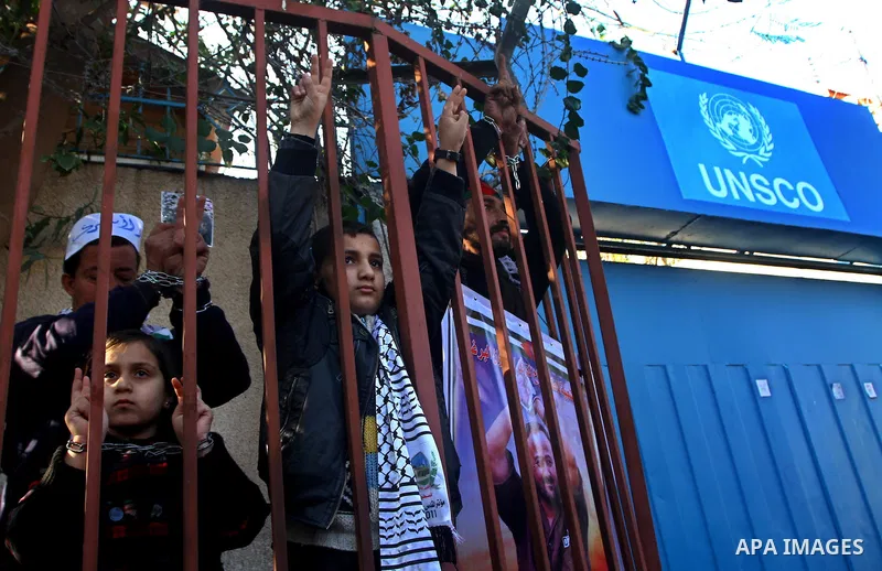 Families of Palestinian prisoners held in Israeli jails take part in a demonstration demanding their release, outside the Red Cross office in Gaza City, Jan. 21, 2012. Photo by Ashraf Amra