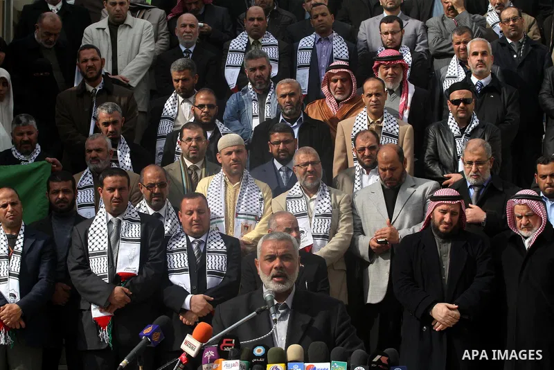 Palestinian Legislative Council members participate in a press conference during a protest in Gaza City on January 21, 2012 in solidarity with Palestinian parliamentary speaker and Hamas member Aziz Dweik, who was arrest...