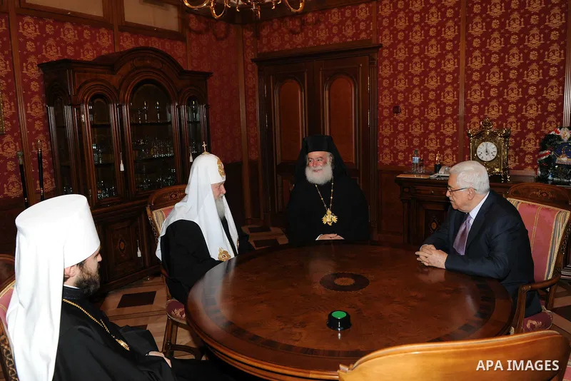 Palestinian President Mahmoud Abbas (Abu Mazen) receives the award of the late Alexei II from the Patriarch of Moscow and all Russia Patriarch Kirill I, in Moscow, on Jan. 21, 2012. Photo by Thaer Ganaim
