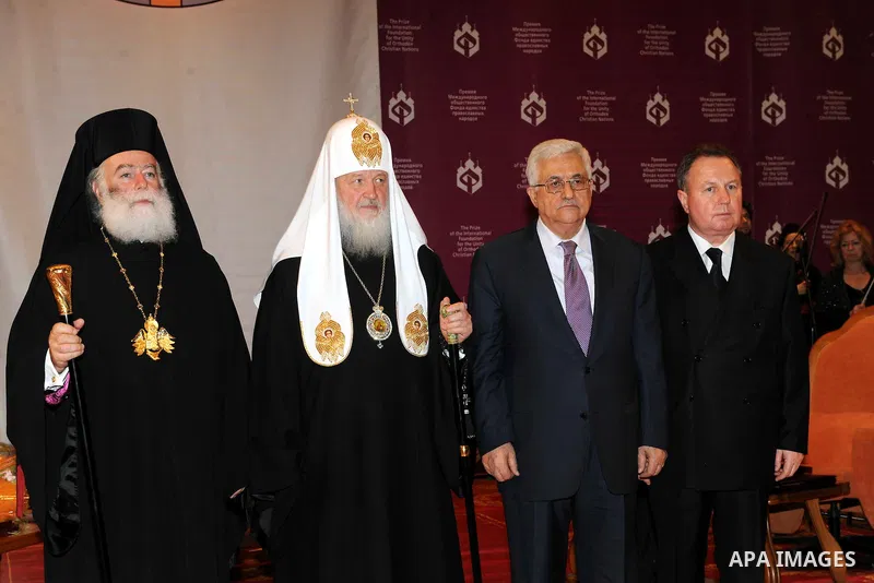 Palestinian President Mahmoud Abbas (Abu Mazen) receives the award of the late Alexei II from the Patriarch of Moscow and all Russia Patriarch Kirill I, in Moscow, on Jan. 21, 2012. Photo by Thaer Ganaim