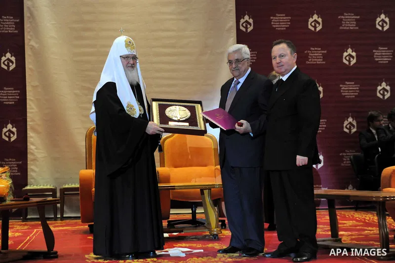 Palestinian President Mahmoud Abbas (Abu Mazen) receives the award of the late Alexei II from the Patriarch of Moscow and all Russia Patriarch Kirill I, in Moscow, on Jan. 21, 2012. Photo by Thaer Ganaim