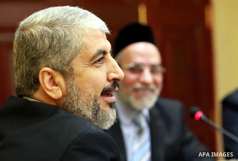 A handout photograph released by the Hamas Press Office shows Egyptian Mohamed Badie leader of the Muslim Brotherhood meets with Palestinian Hamas leader Khaled Meshaal in Cairo, Egypt, 21 January 2012. Photo by Mohammed...