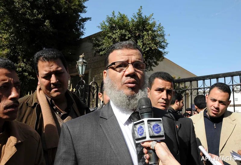 Egyptian parliament member speaks to media upon his arrival for the first parliament session after the revolution that ousted former President Hosni Mubarak, in Cairo January 23, 2012. Egypt's parliament began its first...