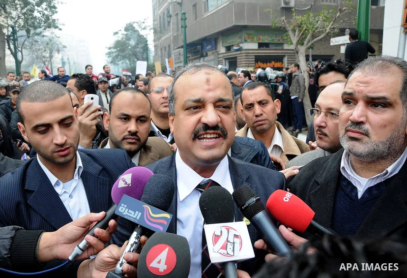 Egyptian parliament member speaks to media upon his arrival for the first parliament session after the revolution that ousted former President Hosni Mubarak, in Cairo January 23, 2012. Egypt's parliament began its first...