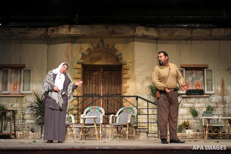 Palestinian artists perform a play during a celebration organized by Women's Affairs Centre in the occasion of the Women's Inheritance Day at al-Shawwa theatre, in Gaza City, on Jan. 24, 2012. Photo by Mohammed Asad