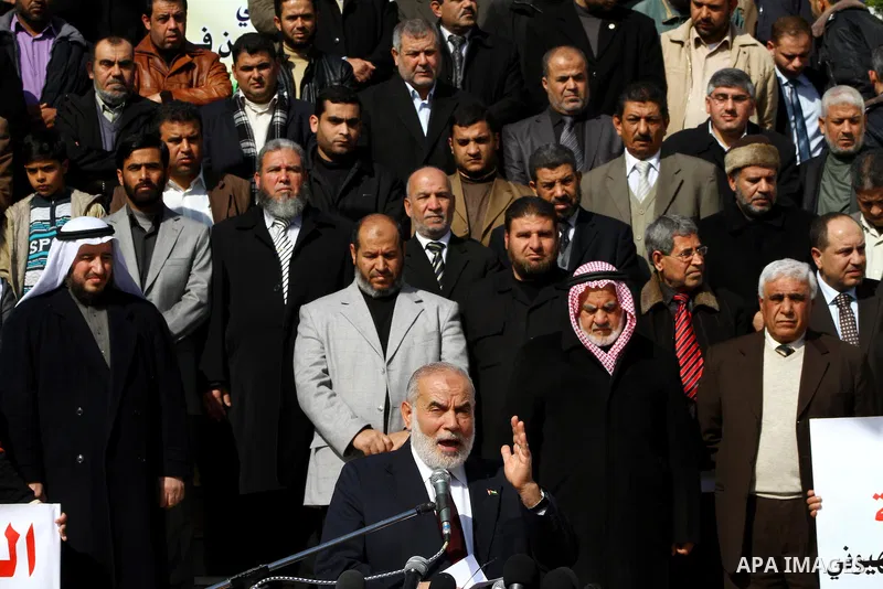 Palestinian Legislative Council members and other officials participate in a press conference during a protest in Gaza City on January 24, 2012 in solidarity with Palestinian parliamentary members, who were arrested by t...