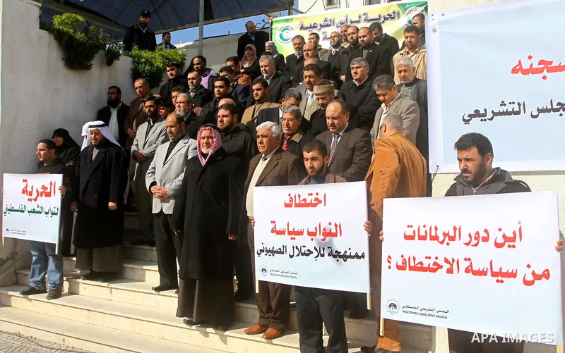 Palestinian Legislative Council members and other officials participate in a press conference during a protest in Gaza City on January 24, 2012 in solidarity with Palestinian parliamentary members, who were arrested by t...