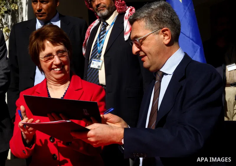 Catherine Ashton shakes hands with Filippo Grandi, Commissioner-General of the UN Relief and Works Agency (UNRWA), in Gaza City , on January 25, 2012. Ashton said that the informal talks between Israel and the Palestinia...