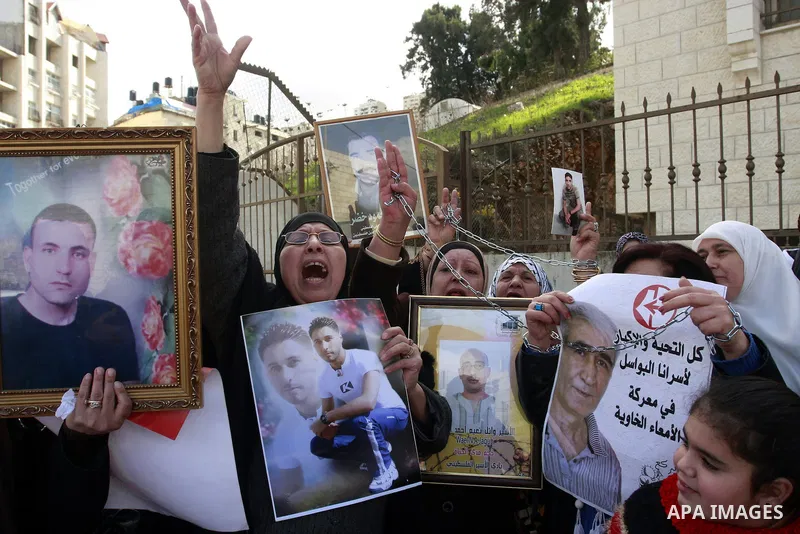 Palestinians participate in a demonstration calling for release of Palestinian prisoners held in the Israeli jails . in the West Bank city of Nablus, Jan. 25, 2012. Israel is currently holding thousands of Palestinians i...