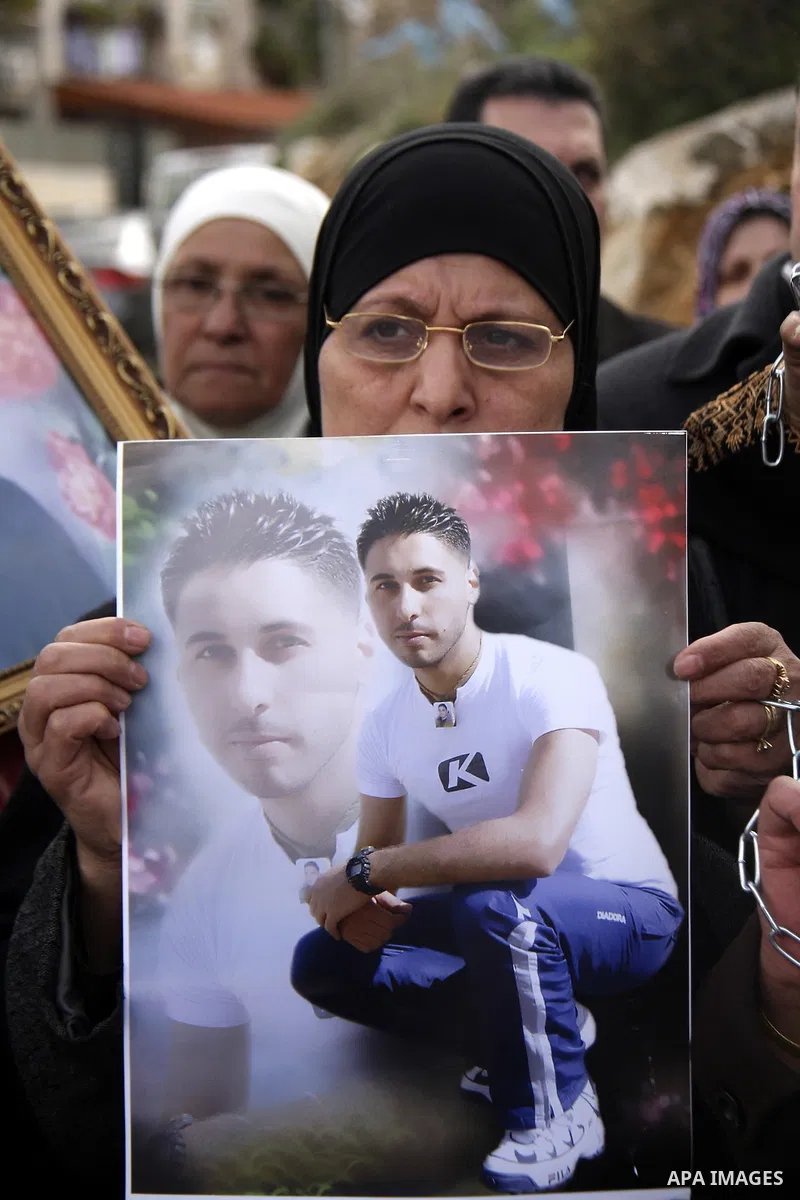 Palestinians participate in a demonstration calling for release of Palestinian prisoners held in the Israeli jails . in the West Bank city of Nablus, Jan. 25, 2012. Israel is currently holding thousands of Palestinians i...
