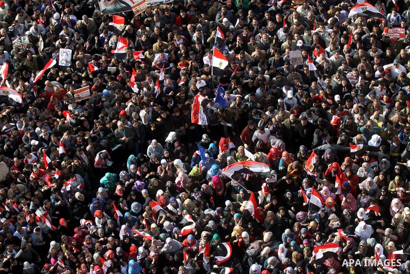 Egyptian demonstrators gather to celebrate the one year anniversary of the 25th January uprising at Tahrir square in Cairo, Egypt, 25 January 2012. One year earlier the same day Egyptians started an uprising which result...