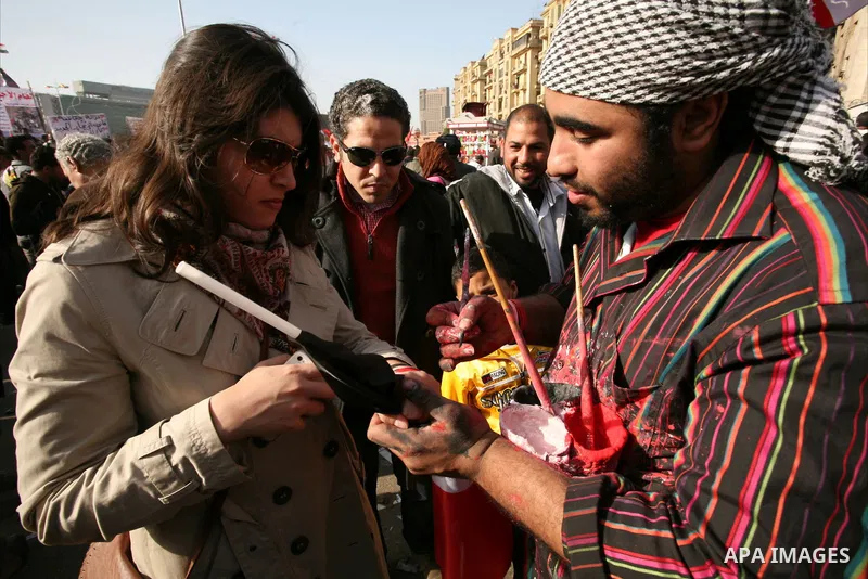 Egyptian demonstrators gather to celebrate the one year anniversary of the 25th January uprising at Tahrir square in Cairo, Egypt, 25 January 2012. One year earlier the same day Egyptians started an uprising which result...