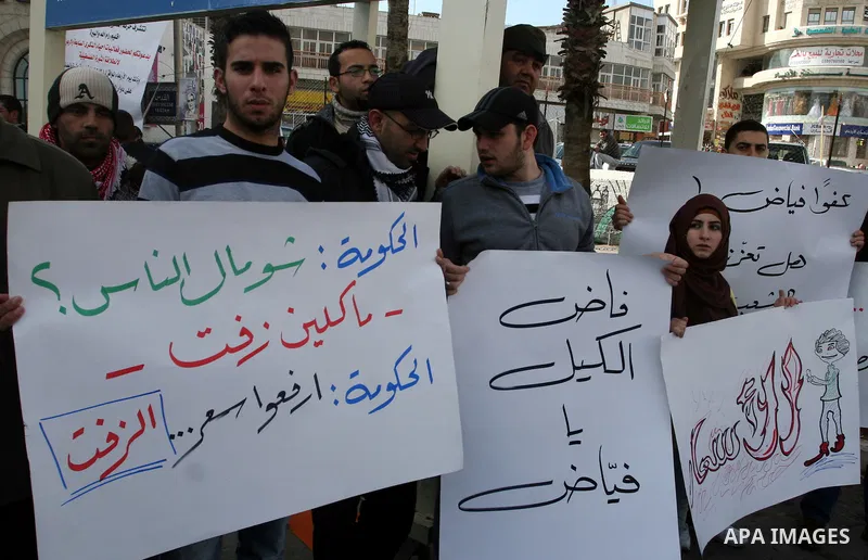 Palestinians demonstrate in the commercial capital of the West Bank city of Ramallah to protest the high cost of living and against adopted policy by Palestinian prime minister Salam Fayyad on January 25, 2012. Photo by...