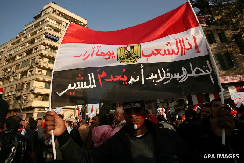 Egyptian demonstrators gather to celebrate the one year anniversary of the 25th January uprising at Tahrir square in Cairo, Egypt, 25 January 2012. One year earlier the same day Egyptians started an uprising which result...