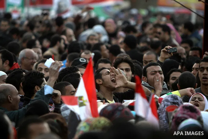 Egyptian demonstrators gather to celebrate the one year anniversary of the 25th January uprising at Tahrir square in Cairo, Egypt, 25 January 2012. One year earlier the same day Egyptians started an uprising which result...