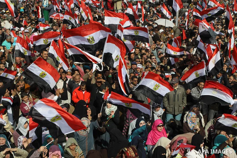 Egyptian demonstrators gather to celebrate the one year anniversary of the 25th January uprising at Tahrir square in Cairo, Egypt, 25 January 2012. One year earlier the same day Egyptians started an uprising which result...
