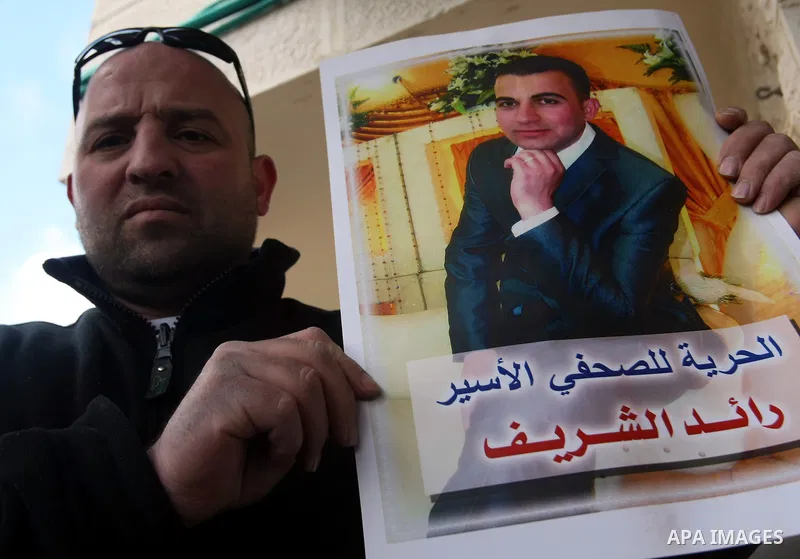Palestinians participate in a demonstration calling for release of Journalist Raed Sharif, held in the Israeli jails . in the West Bank city of Hebron, Jan. 26, 2012. Israel is currently holding thousands of Palestinians...