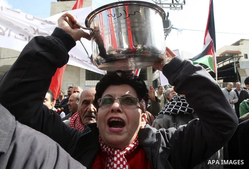 Palestinians protest against rising prices and taxes in the West Bank city of Tul Karem. Thursday, Jan. 26, 2012. Palestinian Authority Prime Minister Salam Fayyad has sparked a furor with a push to get Palestinians to p...