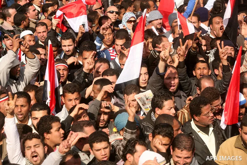 Egyptian demonstrators gather to celebrate the one year anniversary of the 25th January uprising at Tahrir square in Cairo, Egypt, 25 January 2012. One year earlier the same day Egyptians started an uprising which result...