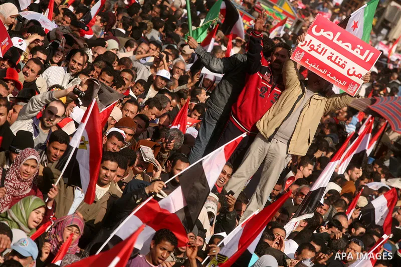 Egyptian demonstrators gather to celebrate the one year anniversary of the 25th January uprising at Tahrir square in Cairo, Egypt, 25 January 2012. One year earlier the same day Egyptians started an uprising which result...